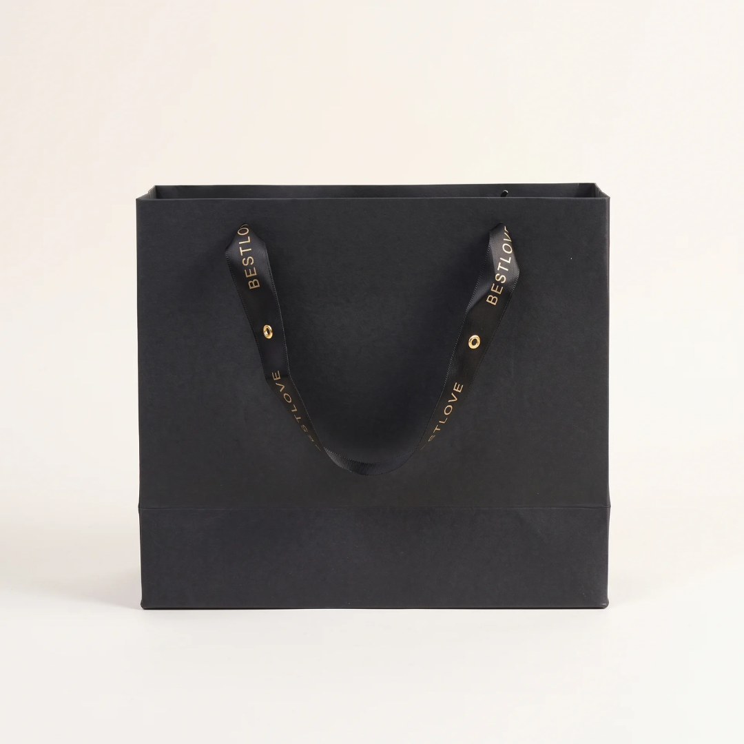Black paper gift bag with ribbon handles